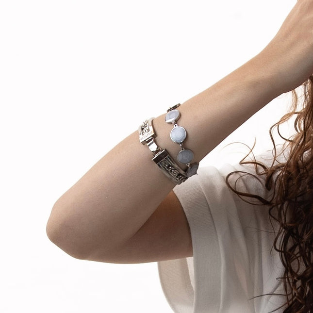 

Model wearing the Fiftyonebrand 51nner NPC bracelet in silver