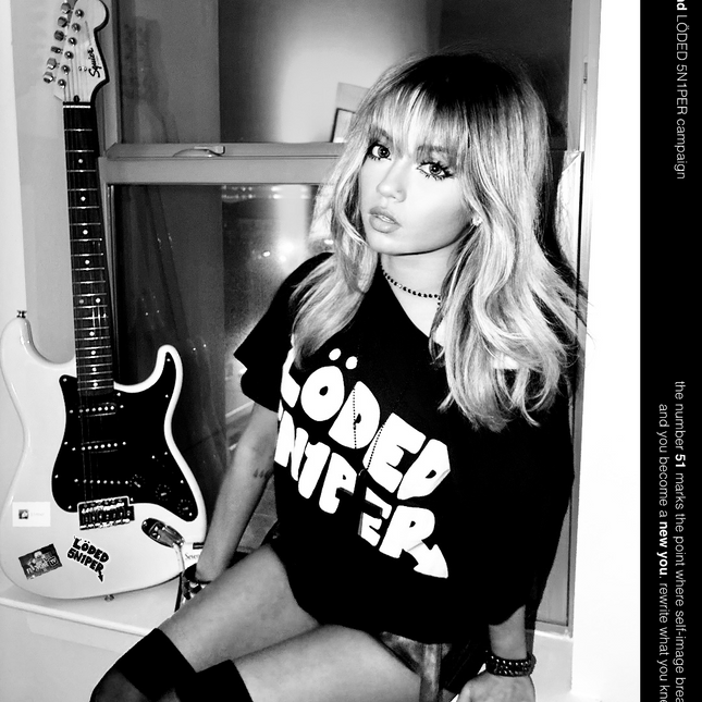Model wearing black Fiftyonebrand Löded 5n1per tee, campaign image